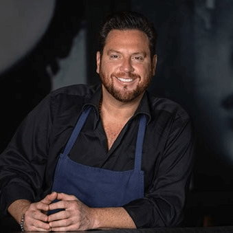 CIA alum Scott Conant smiles at the camera.