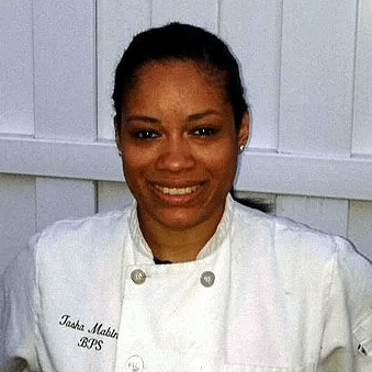  CIA alum Tasha Mabin smiles at the camera.