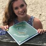 Photo image of Delany's high school graduation cap topper