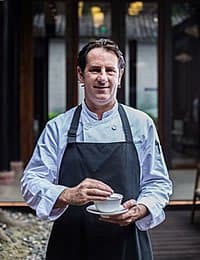 Headshot photo of CIA culinary arts alumnus, Joshua Nudd