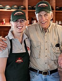 CIA alumna, Katie Ferris poses with her dad at Zoe's Ice Cream Barn