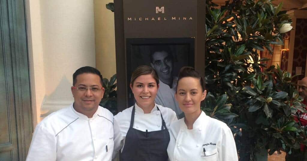 Three chefs standing in front of the Michael Mina restaurant, where 2 CIA alumni staged.
