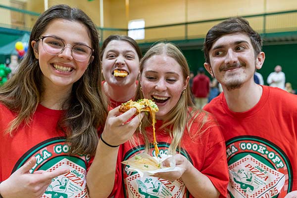 Image of CIA students enjoying the 2025 Pizza Cook-Off at the Hyde Park, NY campus.