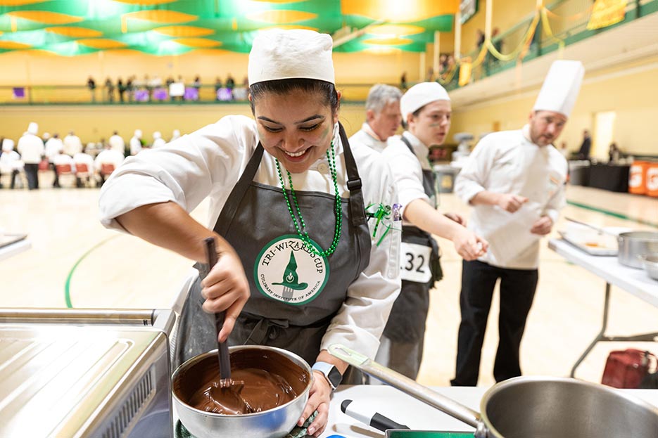 Image of a CIA student during Tri-Wizards Cup in the gymnasium.
