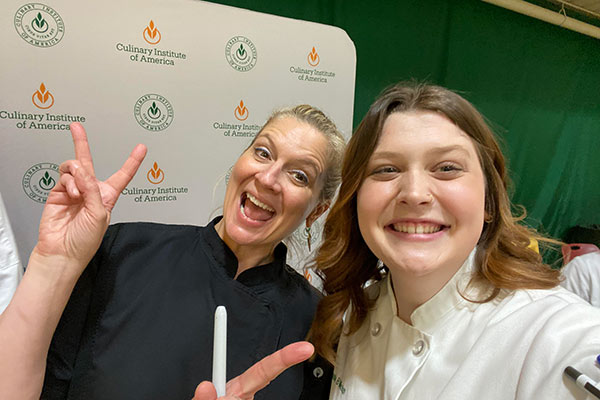 CIA student Annie Milostan with CIA alumni celebrity chef, Amanda Freitag ’89.