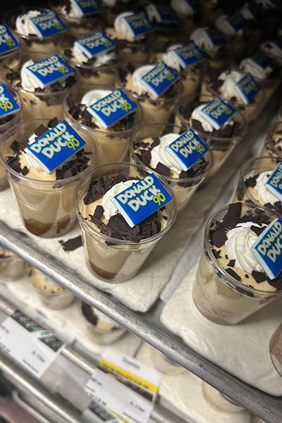 Image of desserts in cups with a Donald Duck sign on them.