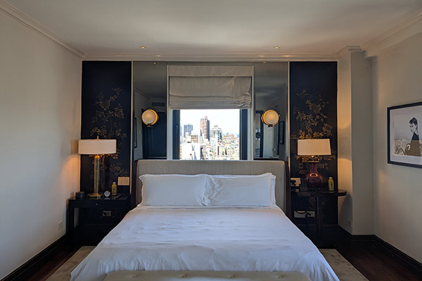 Image of a hotel bed in a room in the Carlyle Hotel in New York City.