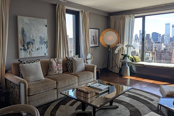Image of a hotel room in the Carlyle Hotel with a view of New York City.