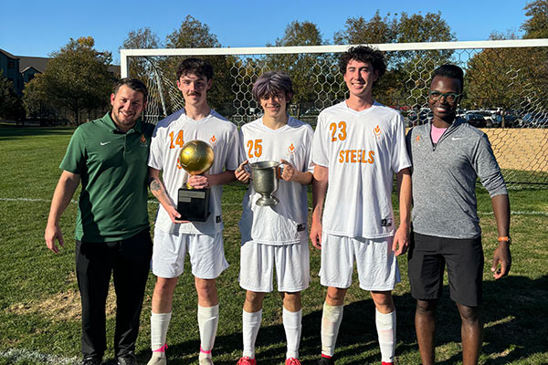 Image of CIA Steels soccer team players with coaches.