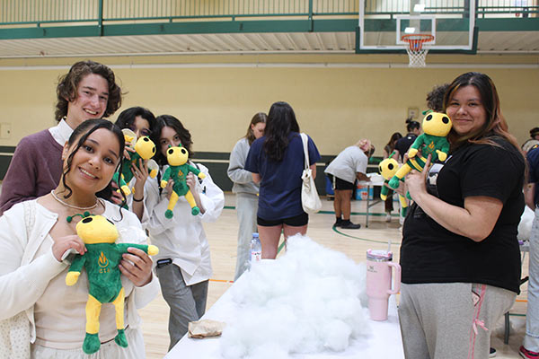 Image of CIA students making Sting plush dolls in the gym at CIA in Hyde Park, NY.