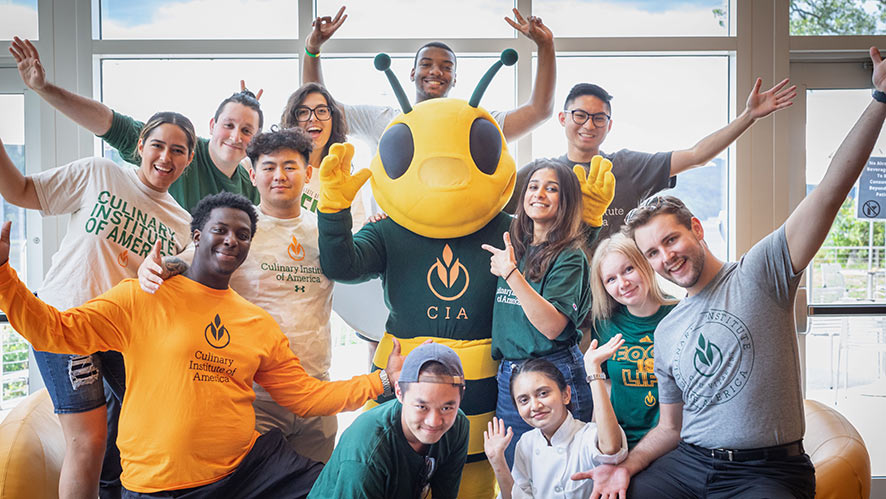 Image of CIA students hanging out with CIA’s mascot Sting in The Egg.