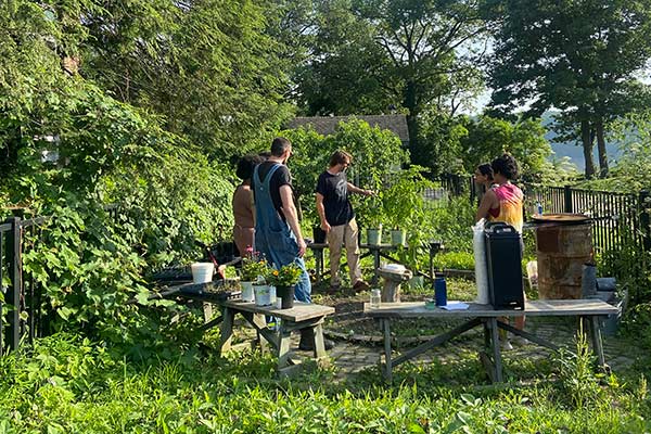 Image of CIA students standing in a CIA student garden.