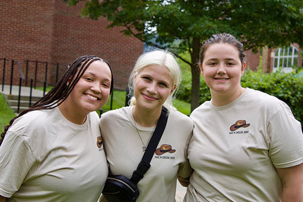 Image of three CIA students competing in the second annual Mac and Cheese Cook-Off held at CIA New York.