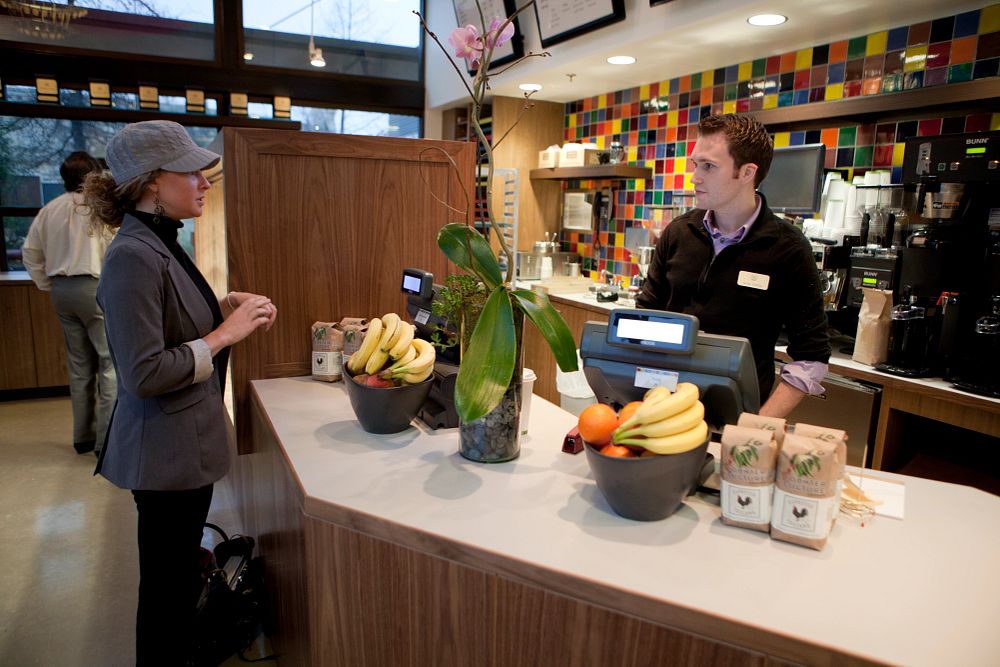 image_tooltip A bakery clerk greets a customer at The Culinary Institute of America Bakery Cafe in San Antonio.