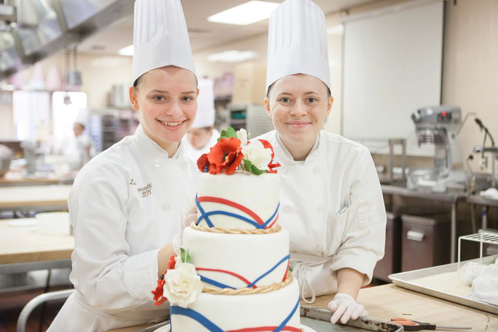 image_tooltip CIA students work on a cake designed for the school's 2016 Veterans Day celebration.