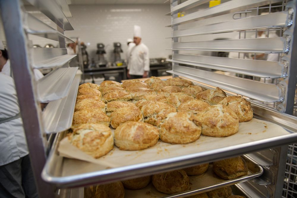 image_tooltip A tray of biscuits sits on a shelf as students work in class at the CIA Student Recreation Center.