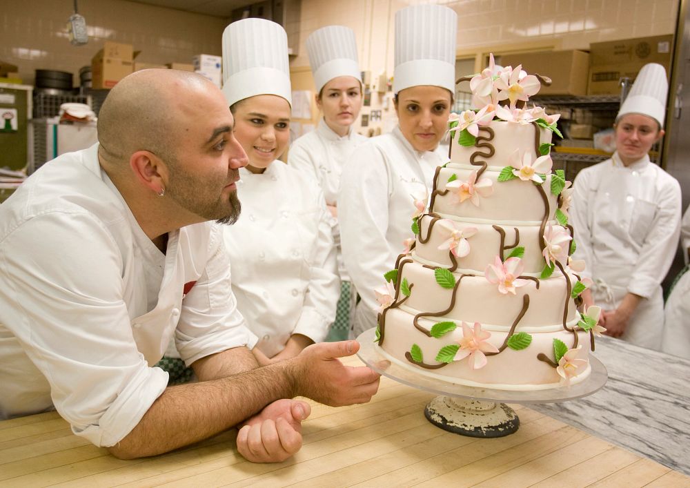 image_tooltip Duff Goldman, CIA class of '98, also known as the Ace of Cakes, visits Chef Cavotti's cake decorating class to discuss the students' designs.