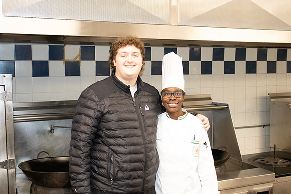 Image of Chef-Instructor Roshara Sanders ’12/’14 and Sidney Rubenstein ’22 standing in a CIA kitchen in Hyde Park, NY.