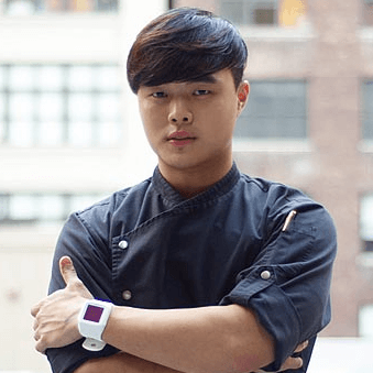 CIA alum Deuki Hong looks to the camera with his arms crossed.