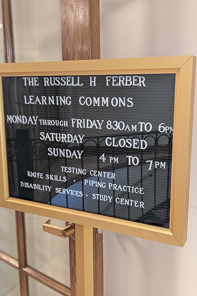 Image of the hours of operation sign at the entrance of The Russell H. Ferber Learning Commons.