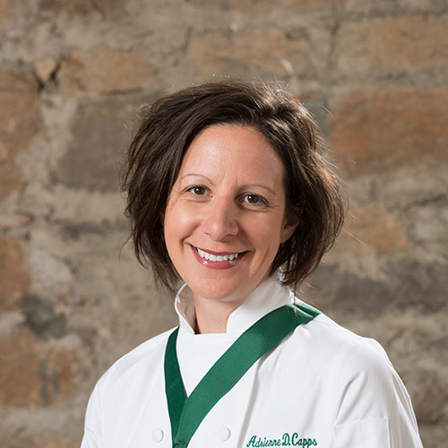 Headshot of CIA Culinary Arts alum Adrienne Capps ’15.