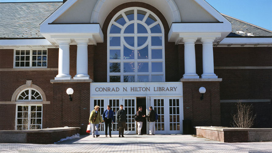 Image of five CIA students outside the Conrad N. Hilton Library on the CIA New York campus in Hyde Park, NY.