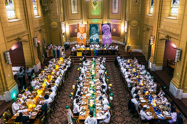 Image of a large group of CIA students dining in Farquharson Hall, during the fifth annual Tri-Wizard Tournament at CIA in Hyde Park, NY.