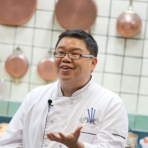 Headshot of CIA Culinary Arts alum Dennis Chan ’00.