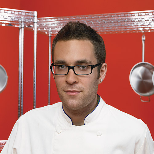 Headshot of CIA Culinary Arts alum Ilan Hall ’02.