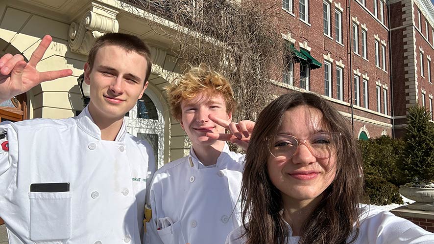 CIA students Jessie Arnett, Tristan Haverfield, and Nathan Tucker outside of Roth Hall.