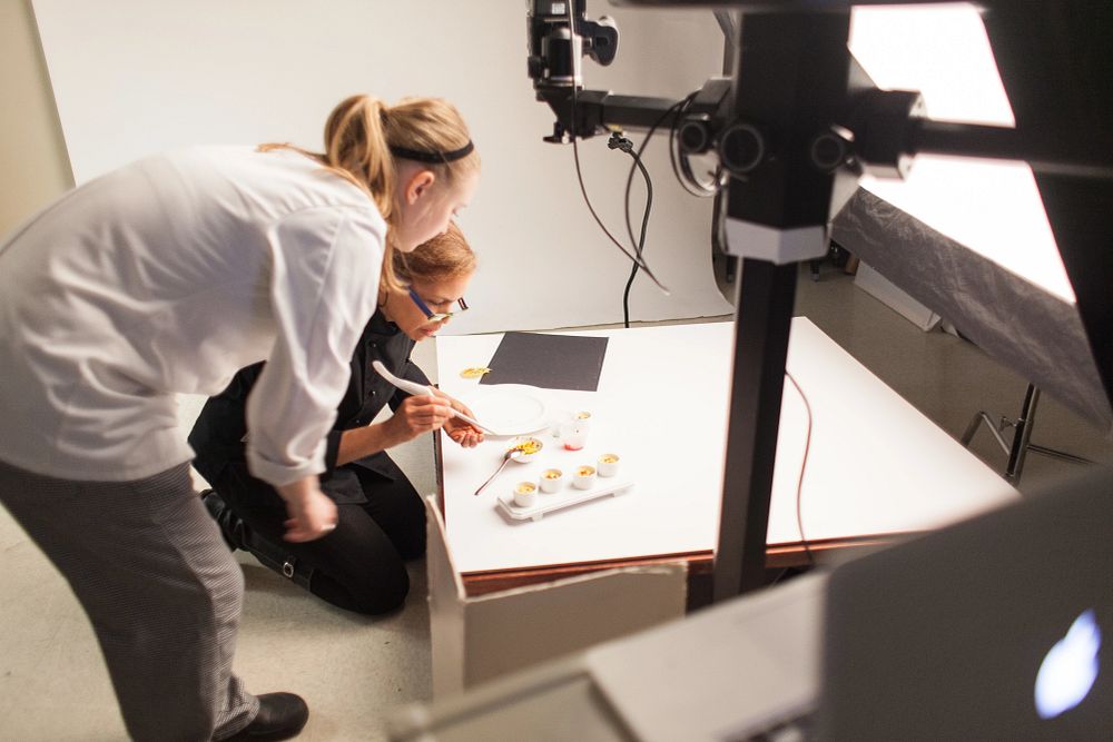 A CIA photo studio shoot with food stylist Kerstin Alm-Bowser and a CIA student.